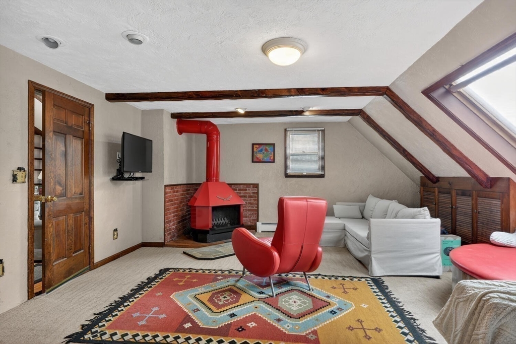 15 Rocky Pond Road Boylston, MA 01505 - Photo 24 of 39 a living room with furniture and a flat screen tv