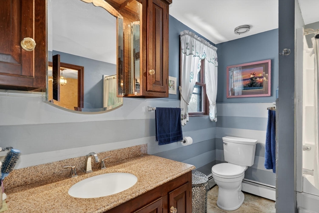 15 Rocky Pond Road Boylston, MA 01505 - Photo 32 of 39 a bathroom with a granite countertop toilet sink and mirror