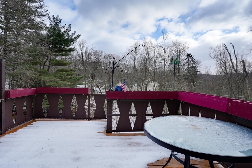 15 Rocky Pond Road Boylston, MA 01505 - Photo 37 of 39 a view of a chairs and tables in the backyard