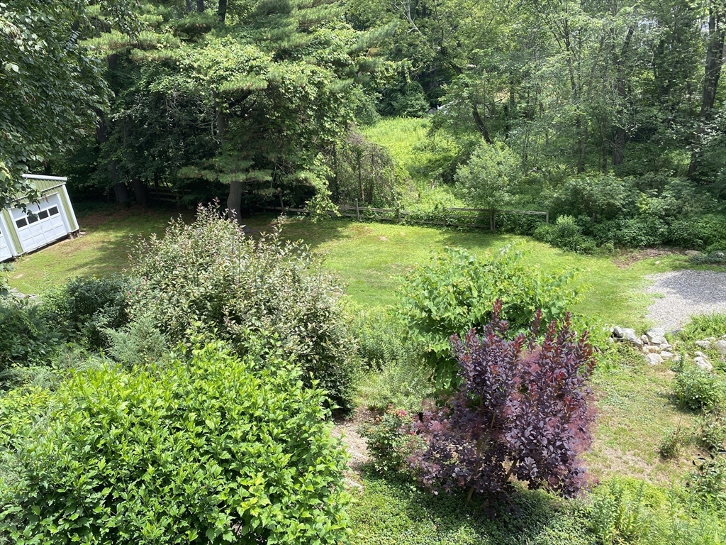 15 Rocky Pond Road Boylston, MA 01505 - Photo 9 of 39 a view of a garden with a lake