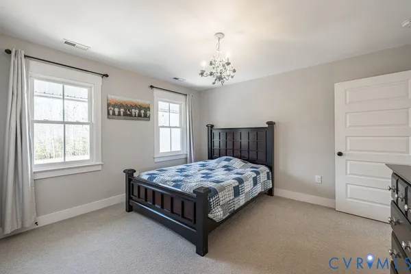 a kitchen with stainless steel appliances granite countertop white cabinets granite counter tops and a wooden floors