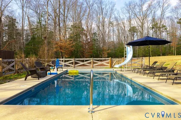 a view of a swimming pool with a patio