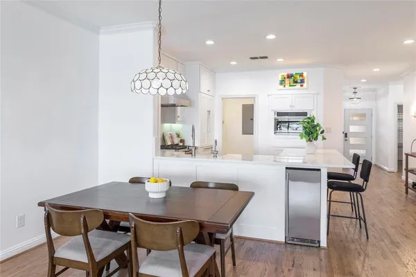 a view of kitchen and dining area with furniture