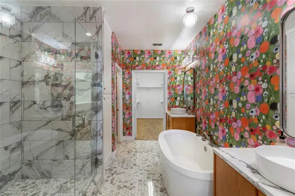 a bathroom with a sink toilet and shower curtain