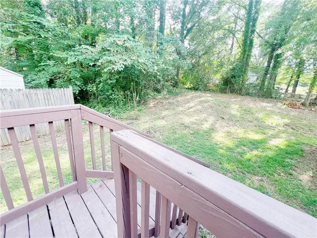 a view of a balcony with wooden floor