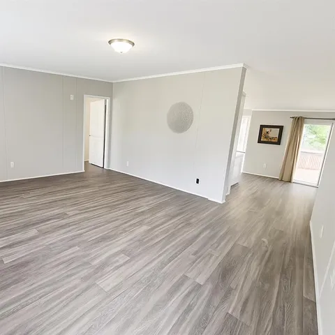 a view of a livingroom with wooden floor