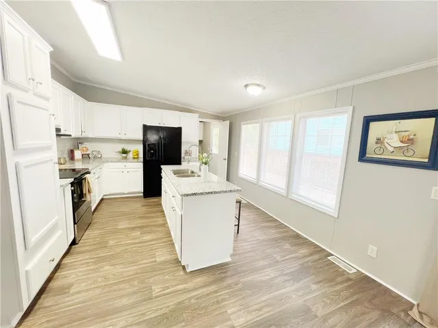 a room with a couch and a wooden floor