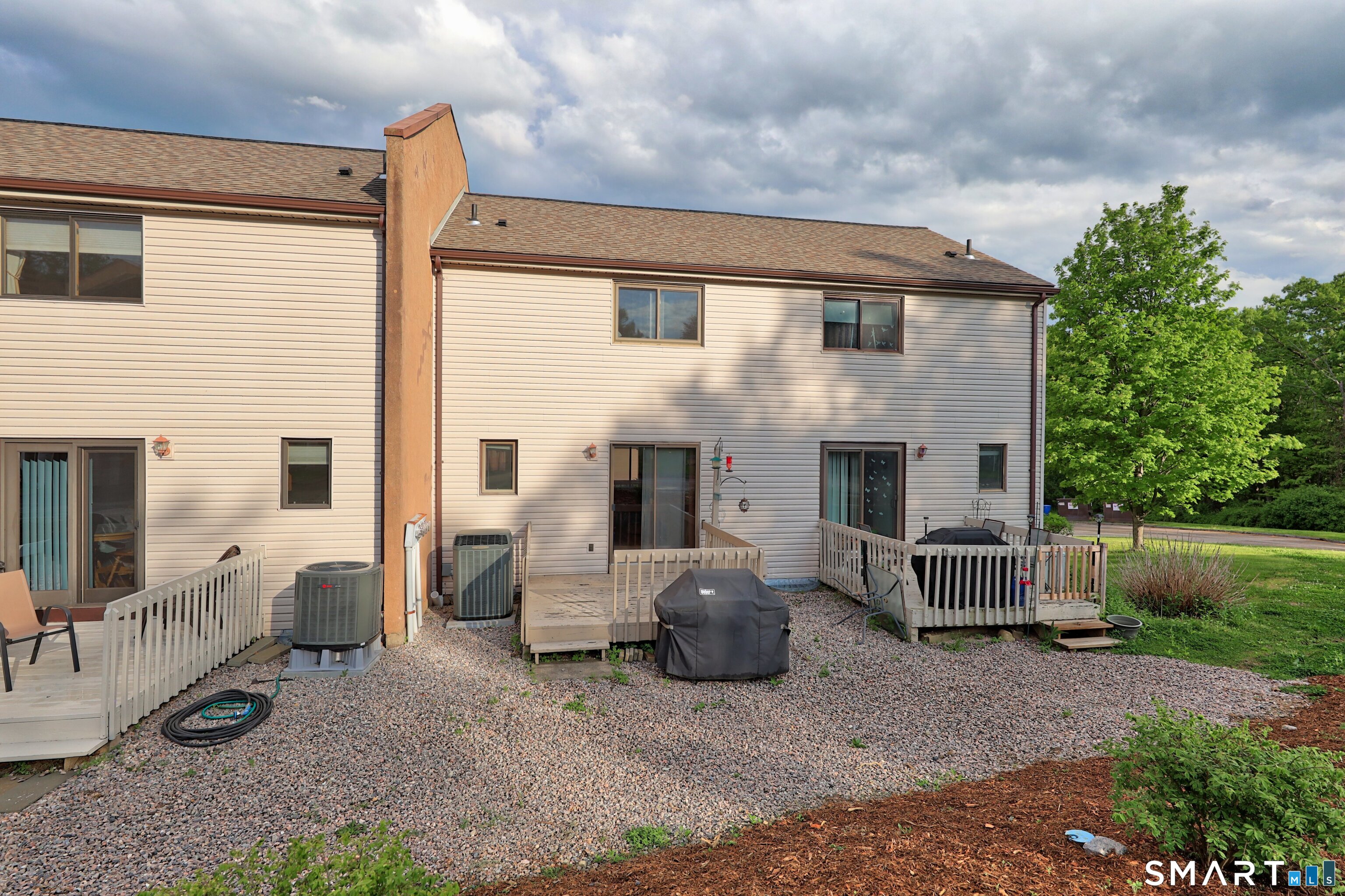 349 Allen Road, Unit 34C Torrington, CT 06790 - Photo 26 of 31 a view of a patio with furniture and a yard