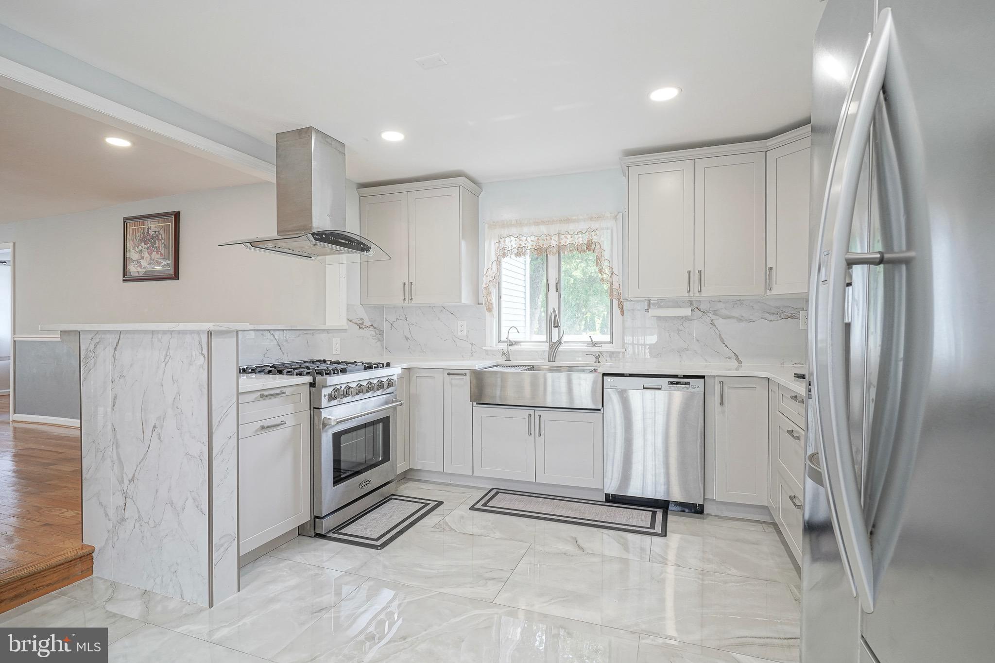 98 Kelly Driver Road Clementon, NJ 08021 - Photo 14 of 40 a kitchen with white cabinets and refrigerator