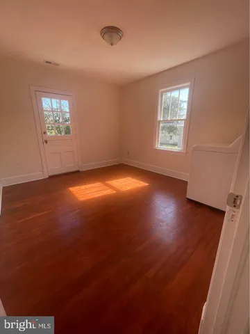 a view of a car parked in back of a house