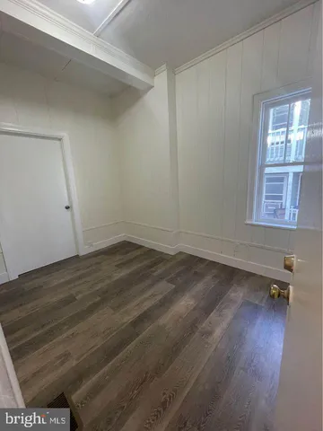 a kitchen with wooden cabinets and a sink