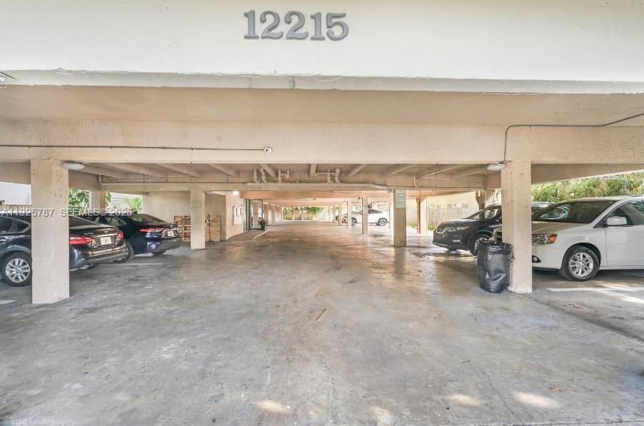 12215 West Dixie Highway, Unit 306 North Miami, FL 33161 - Photo 6 of 7 a view of a car garage