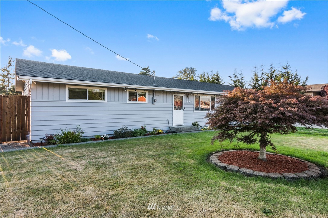 7404 Golden Given Road East Tacoma, WA 98404 - Photo 1 of 23 a view of a backyard with plants and palm tree