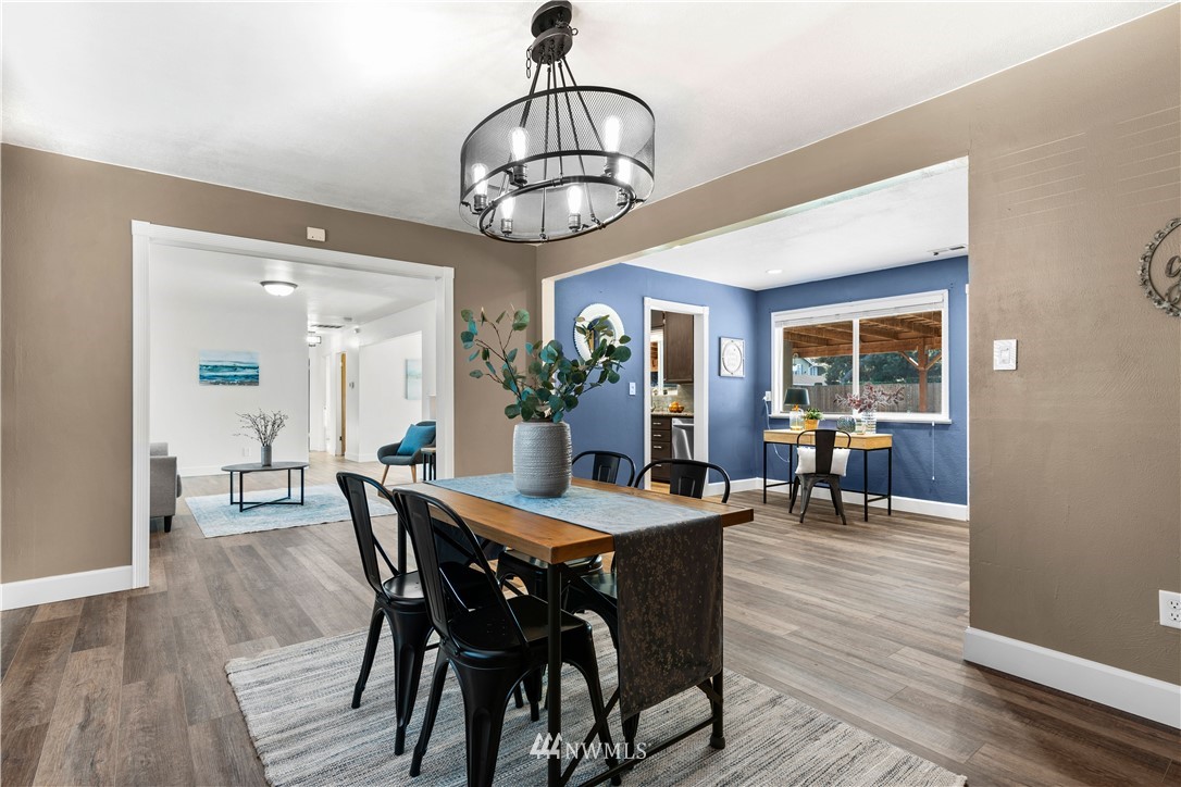 7404 Golden Given Road East Tacoma, WA 98404 - Photo 11 of 23 a view of a dining room with furniture window and wooden floor