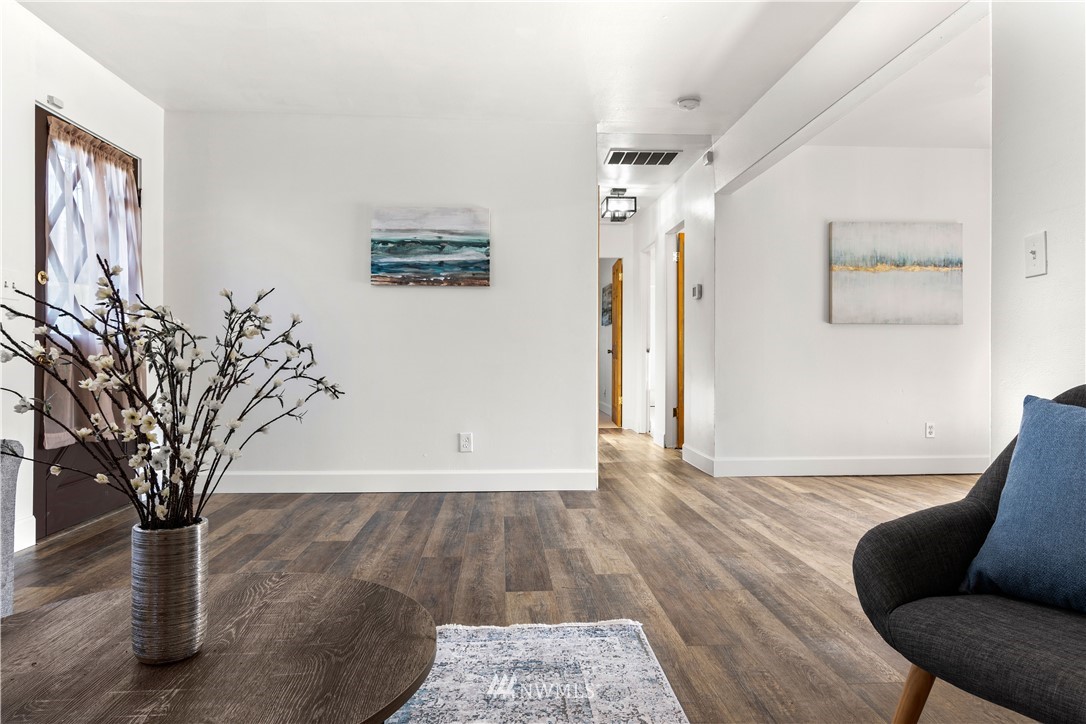 7404 Golden Given Road East Tacoma, WA 98404 - Photo 6 of 23 a view of a livingroom with wooden floor and a potted plant