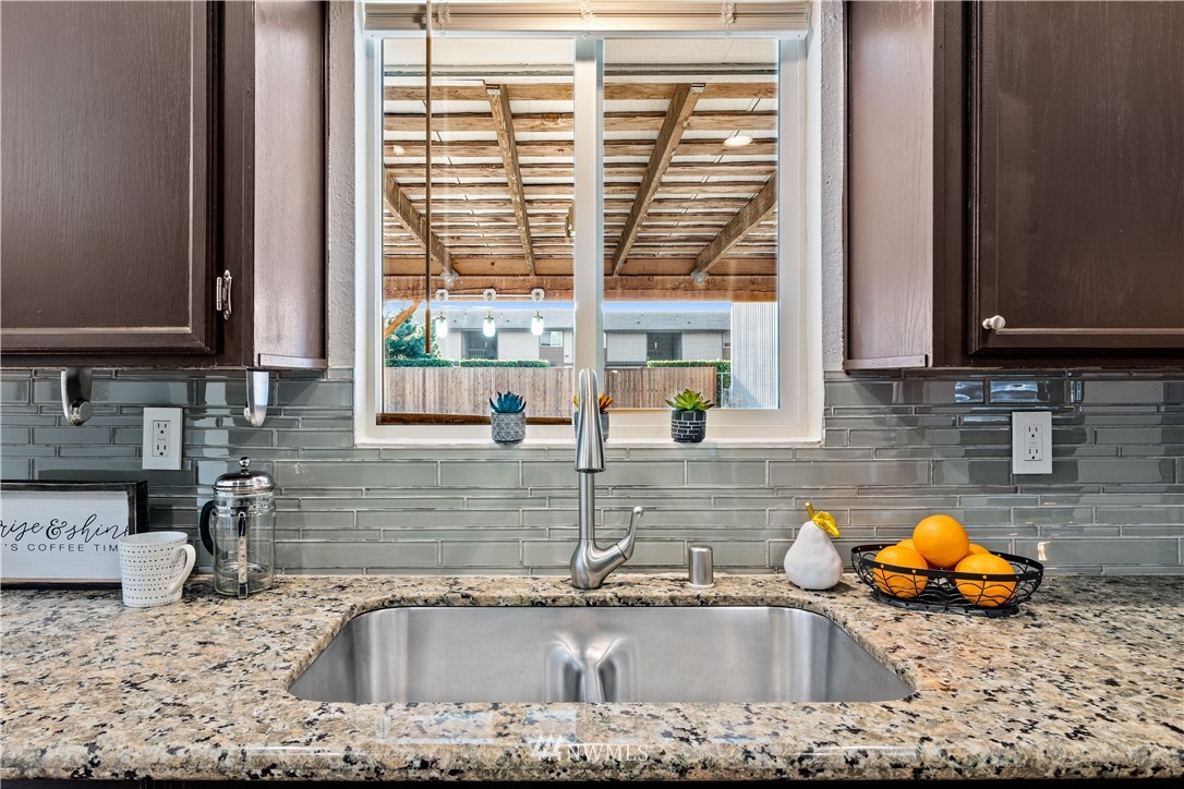 7404 Golden Given Road East Tacoma, WA 98404 - Photo 8 of 23 a kitchen with sink a window and cabinets