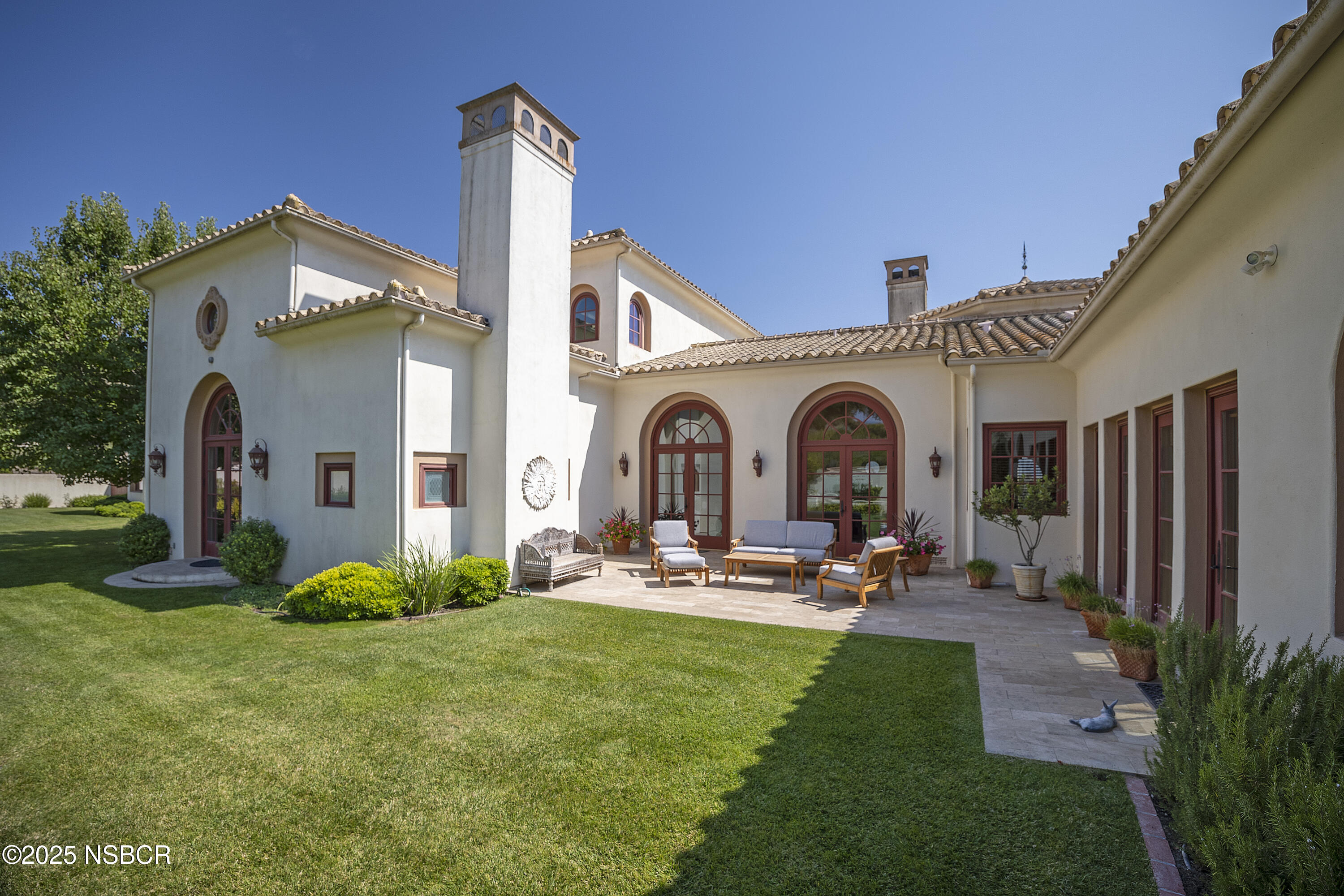 9985 Alisos Canyon Road Los Alamos, CA 93440 - Photo 21 of 25 a front view of a house with garden and patio