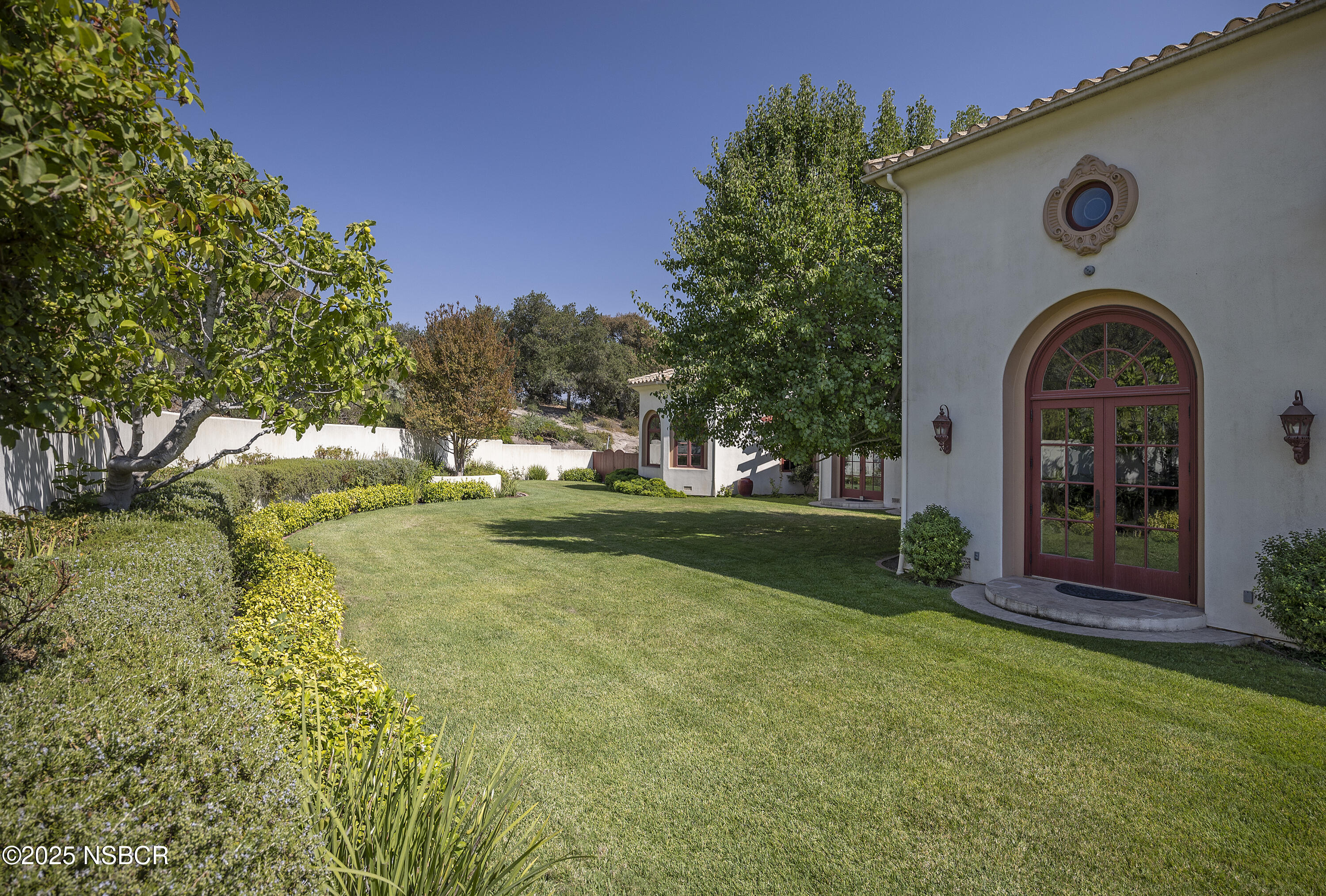 9985 Alisos Canyon Road Los Alamos, CA 93440 - Photo 23 of 25 a view of house with garden space and trees in the background