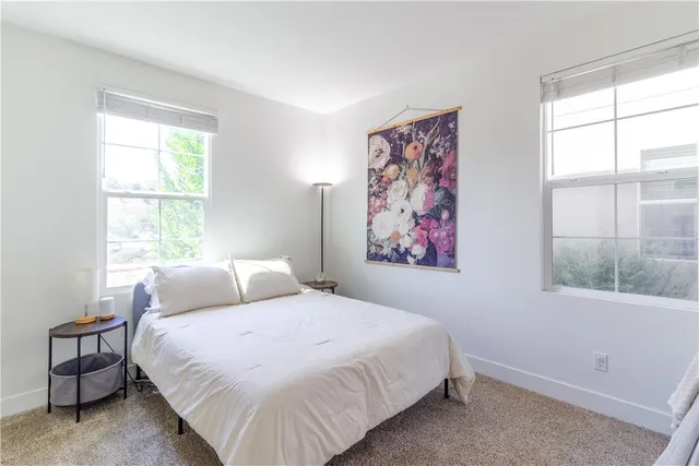 a bathroom with a sink a toilet and shower curtain