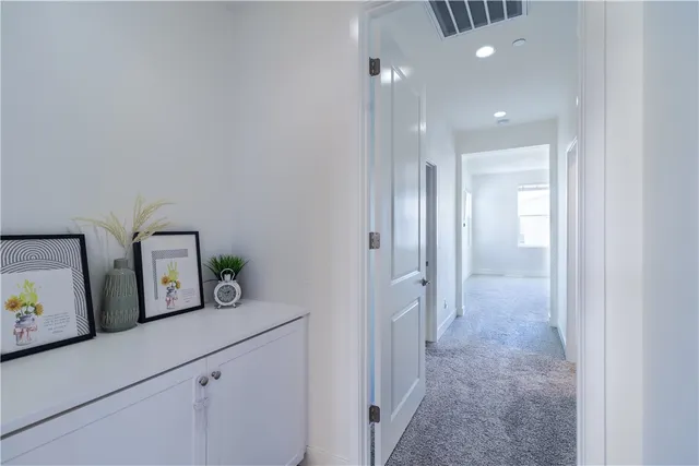 a bathroom with a double vanity sink and a window