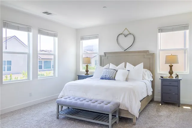 a bathroom with a granite countertop and a toilet