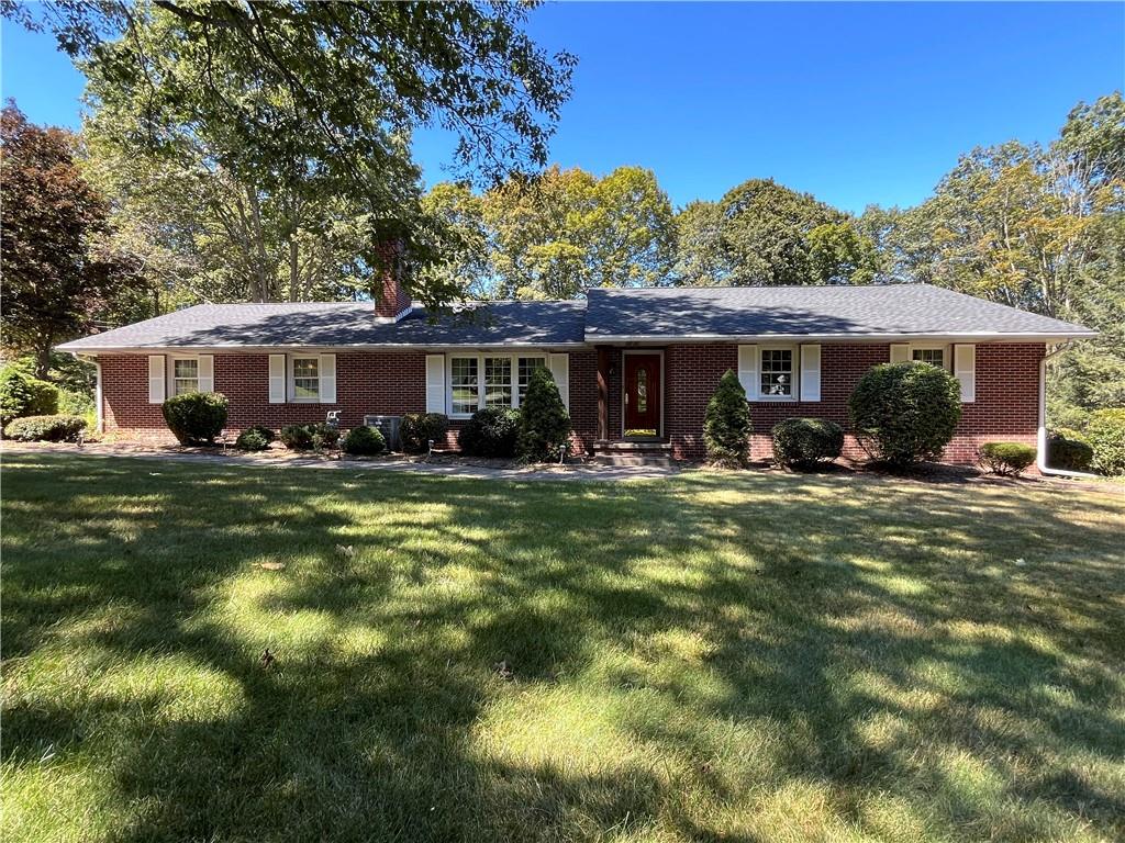 629 Clover Hill Road Somerset, PA 15501 - Photo 1 of 47 a front view of a house with a yard table and chairs