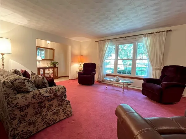 a living room with furniture fireplace and a flat screen tv