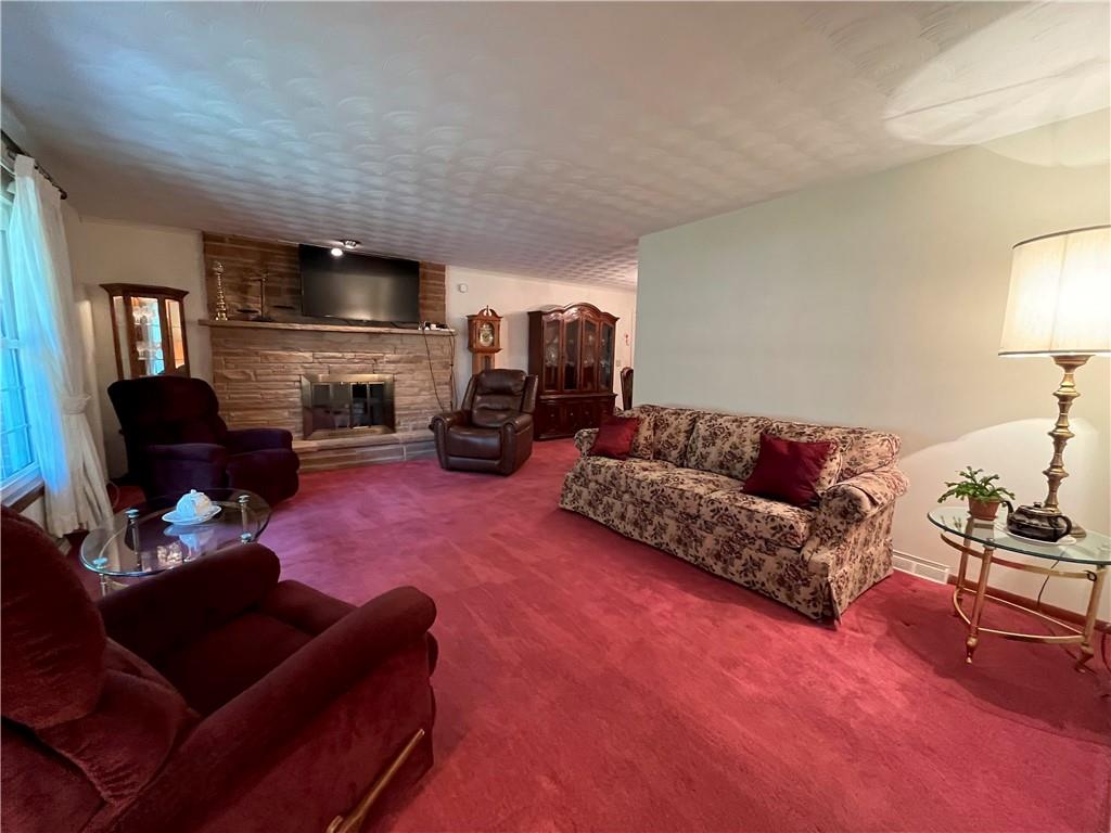 629 Clover Hill Road Somerset, PA 15501 - Photo 15 of 47 a living room with furniture fireplace and a flat screen tv