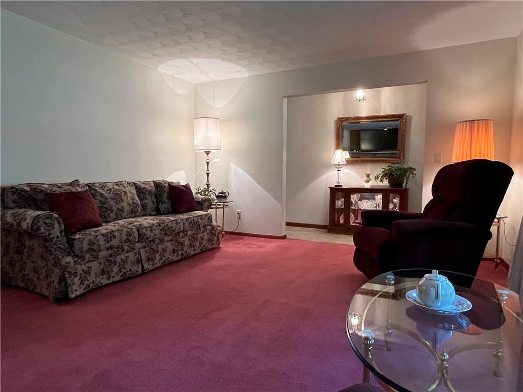 629 Clover Hill Road Somerset, PA 15501 - Photo 18 of 47 a living room with furniture flat screen tv and wooden floor
