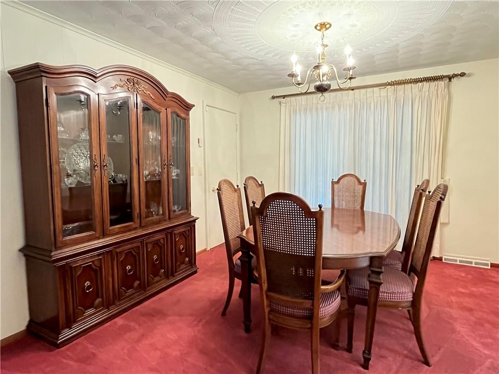 629 Clover Hill Road Somerset, PA 15501 - Photo 20 of 47 a view of a dining room with furniture and chandelier