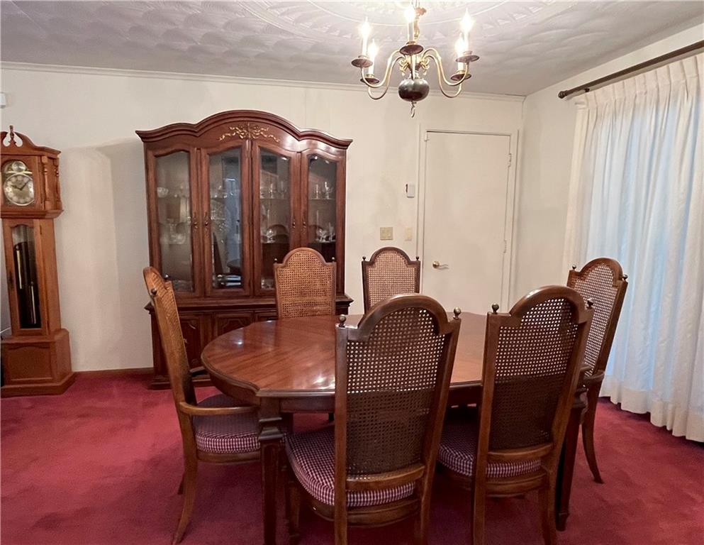 629 Clover Hill Road Somerset, PA 15501 - Photo 21 of 47 a view of a dining room with furniture and wooden floor