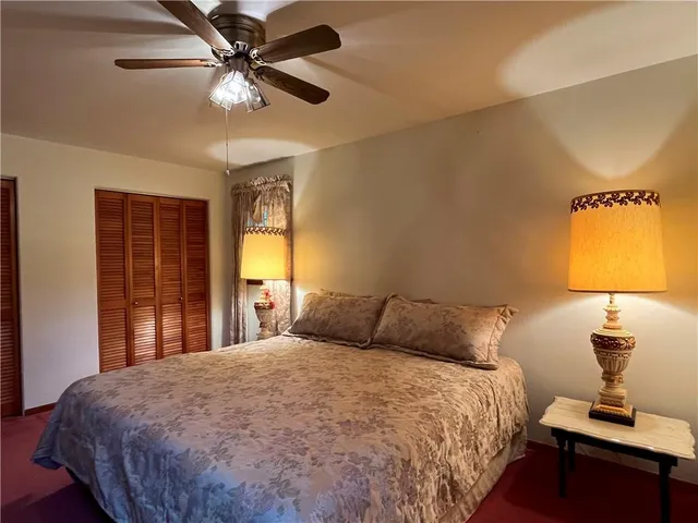 a bed room with a bed and a mirror