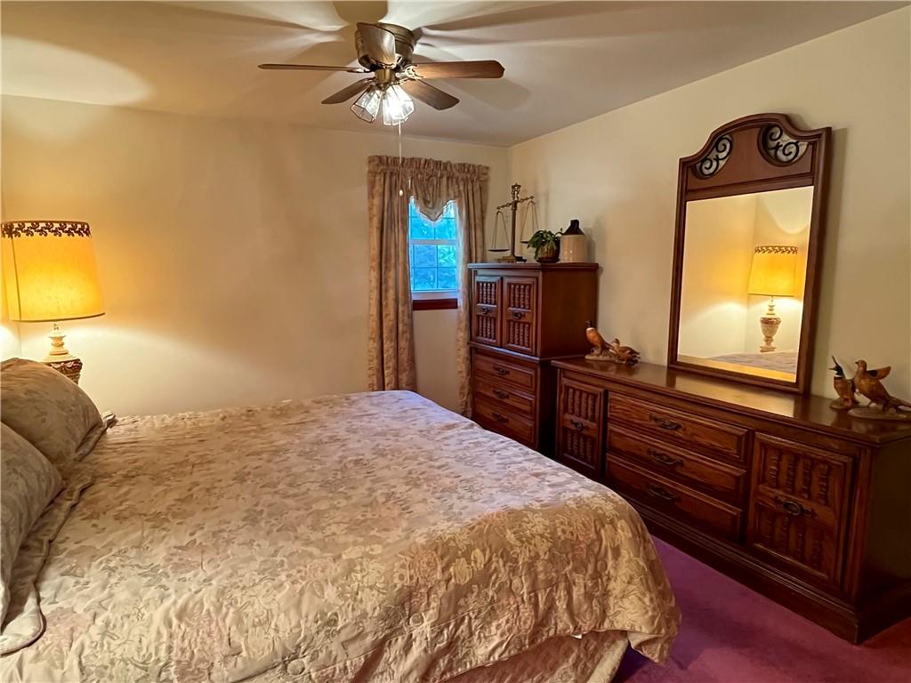 629 Clover Hill Road Somerset, PA 15501 - Photo 25 of 47 a bedroom with a bed and wooden floor