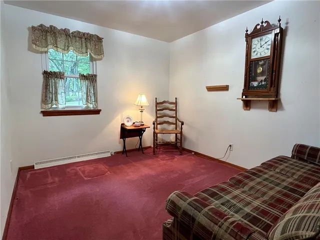 a bedroom with furniture and window