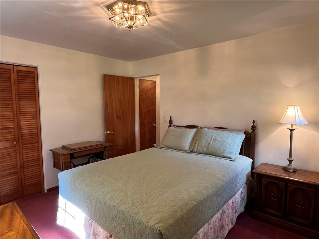 629 Clover Hill Road Somerset, PA 15501 - Photo 34 of 47 a large bed in a bedroom next to a lamp