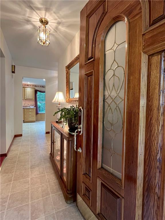 629 Clover Hill Road Somerset, PA 15501 - Photo 4 of 47 a hallway with painting and a chandelier