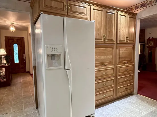 a view of a hallway with closet and furniture