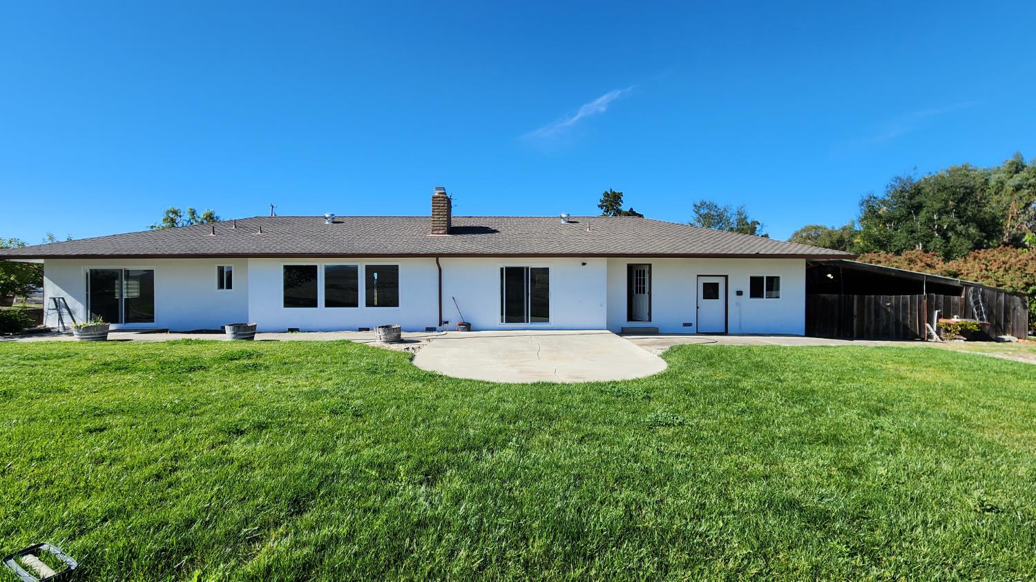 307 Mansfield Road Hollister, CA 95023 - Photo 23 of 62 a view of a house with a backyard