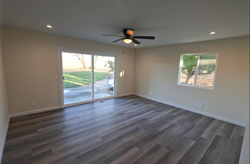 307 Mansfield Road Hollister, CA 95023 - Photo 27 of 62 a view of an empty room with wooden floor and a window