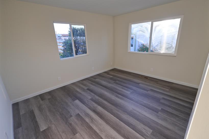 307 Mansfield Road Hollister, CA 95023 - Photo 29 of 62 a view of an empty room with wooden floor and a window