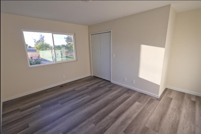 307 Mansfield Road Hollister, CA 95023 - Photo 30 of 62 a view of empty room with wooden floor and fan
