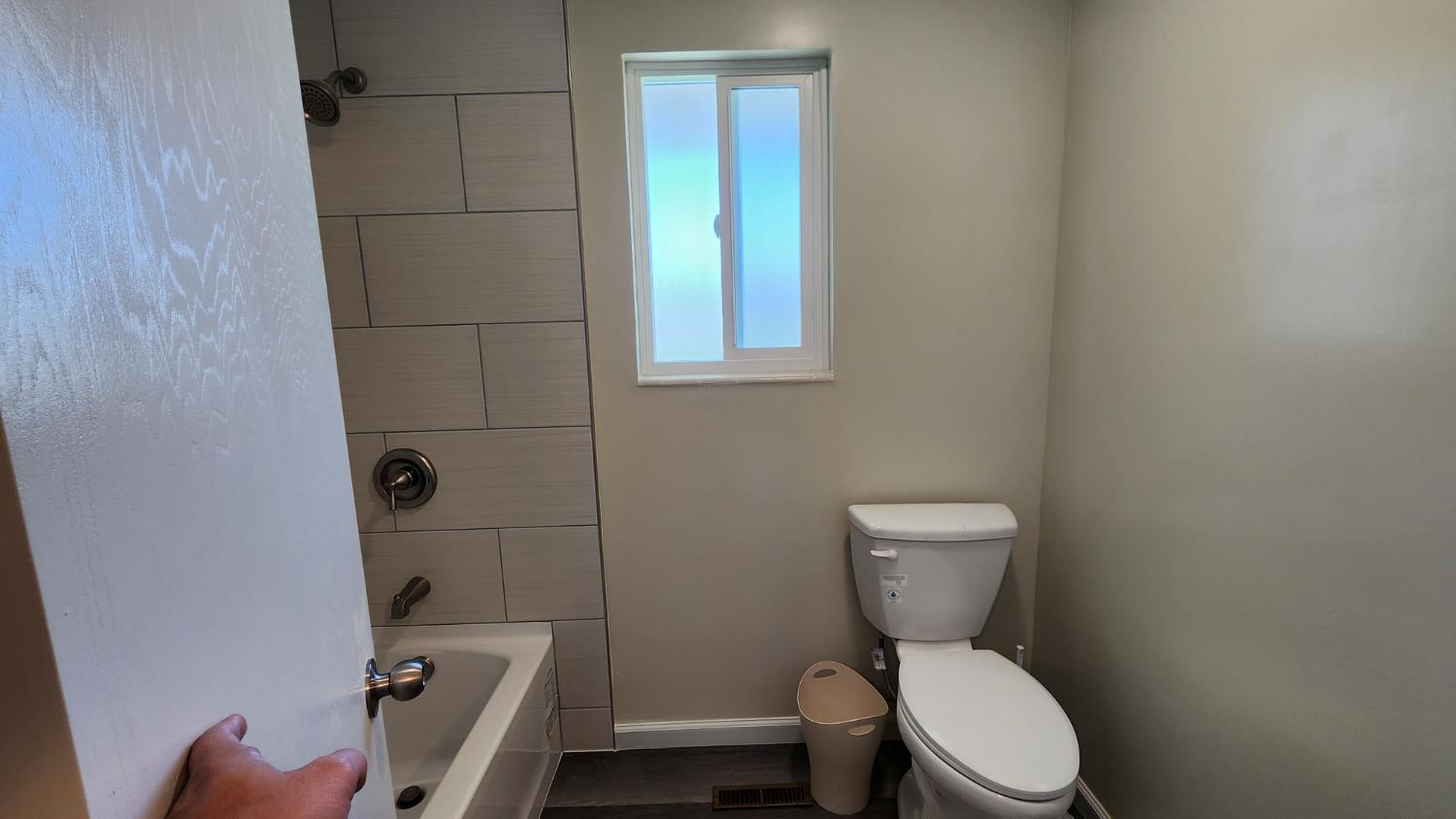 307 Mansfield Road Hollister, CA 95023 - Photo 38 of 62 a white toilet sitting next to a bathroom sink and a tub