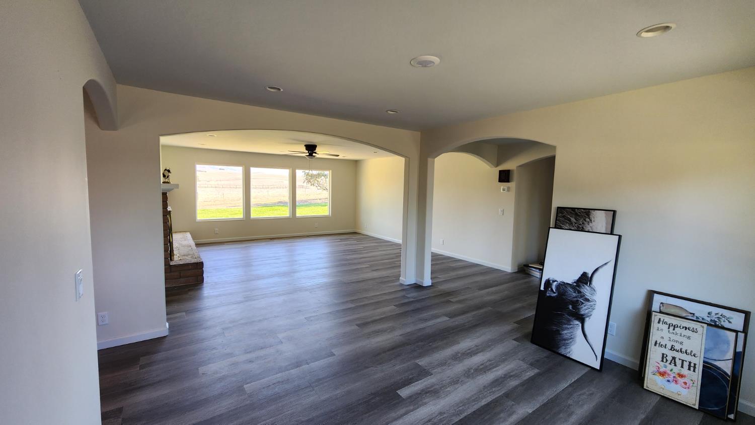 307 Mansfield Road Hollister, CA 95023 - Photo 55 of 62 a view of a hallway with wooden floor and a living room
