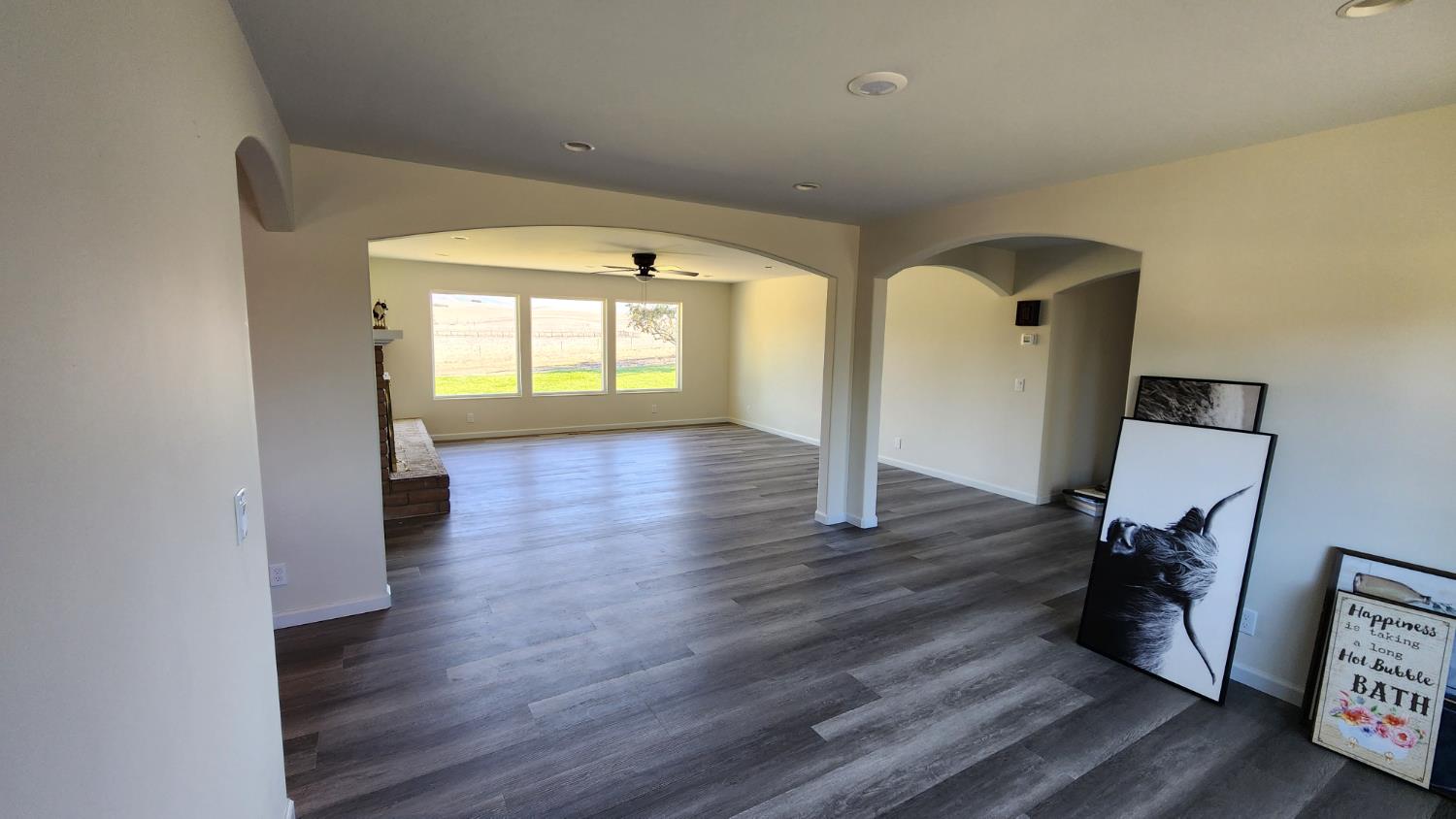 307 Mansfield Road Hollister, CA 95023 - Photo 56 of 62 a view of empty room with wooden floor and fan