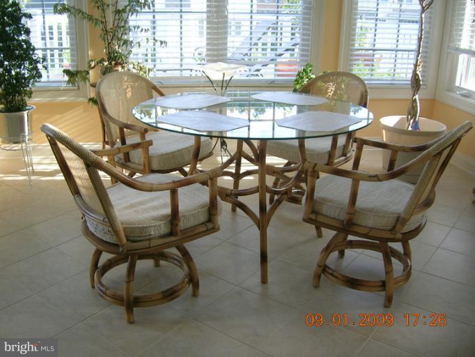 8919 Ricky Trevor Road Perry Hall, MD 21128 - Photo 2 of 27 a view of a dining room with furniture and window