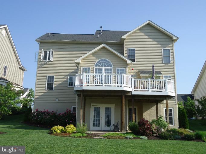 8919 Ricky Trevor Road Perry Hall, MD 21128 - Photo 13 of 27 a front view of a house with a garden