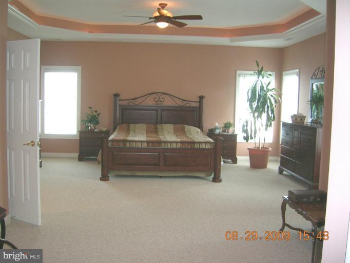8919 Ricky Trevor Road Perry Hall, MD 21128 - Photo 14 of 27 a room with furniture and a chandelier