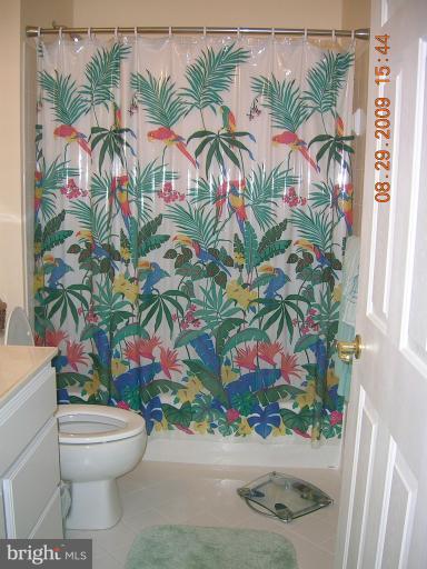 8919 Ricky Trevor Road Perry Hall, MD 21128 - Photo 17 of 27 a bathroom with a toilet sink and mirror