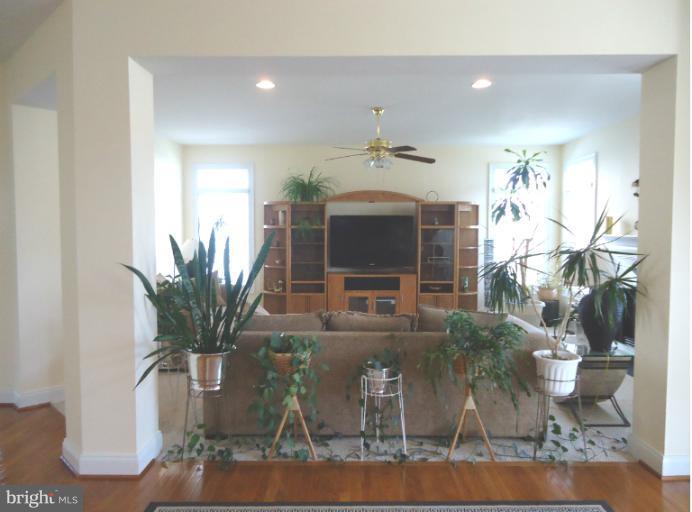 8919 Ricky Trevor Road Perry Hall, MD 21128 - Photo 19 of 27 a view of living room with furniture and a potted plant