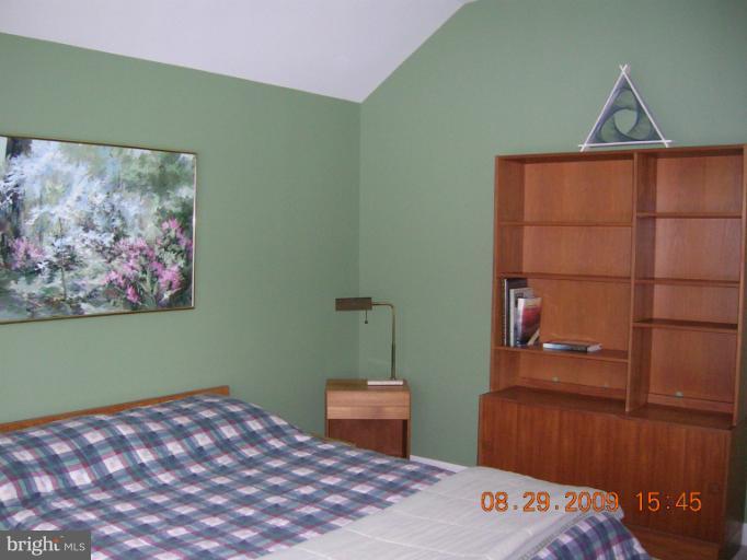 8919 Ricky Trevor Road Perry Hall, MD 21128 - Photo 26 of 27 a bedroom with a bed and a window